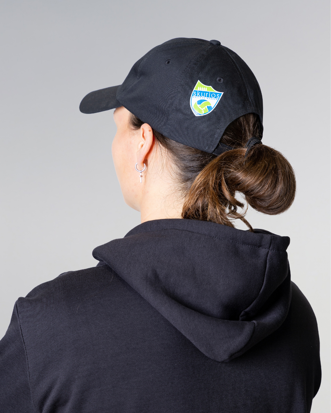 cap with logo of volleyball team skurios and model from back